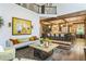 Open concept living space with view to kitchen, wooden beams, and gorgeous hardwood floors at 3938 Hillsman Ln, Marietta, GA 30062
