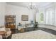Bright office with glass desk, modern furnishings and many built-in bookshelves at 3938 Hillsman Ln, Marietta, GA 30062
