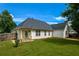 Well-manicured backyard with a patio and partial fencing, creating a private outdoor space at 4005 Brushymill Ct, Loganville, GA 30052