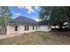 Exterior view of home with a backyard and a view of the home's siding and backyard at 4005 Brushymill Ct, Loganville, GA 30052