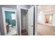 View of bathroom, closet and main bedroom featuring neutral walls and carpeting at 4005 Brushymill Ct, Loganville, GA 30052