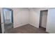 Spacious bedroom with neutral carpeting, multiple closets, and a ceiling fan at 4005 Brushymill Ct, Loganville, GA 30052