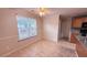 Sun-drenched breakfast nook with tiled floor and view of the outside yard at 4005 Brushymill Ct, Loganville, GA 30052
