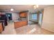 Open concept kitchen features natural wood cabinetry and breakfast nook area at 4005 Brushymill Ct, Loganville, GA 30052