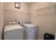 Convenient laundry room with washer, dryer, and ample shelving for storage at 4005 Brushymill Ct, Loganville, GA 30052