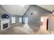 Bright living room with vaulted ceiling, fireplace, and seamless flow to the kitchen at 4005 Brushymill Ct, Loganville, GA 30052