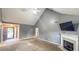 Inviting living room featuring a vaulted ceiling, fireplace, and view of the front entrance at 4005 Brushymill Ct, Loganville, GA 30052