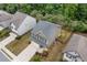 Aerial view of a two-story home with a gray roof, landscaping, and a two-car garage at 4120 Cordova Ln, Cumming, GA 30028