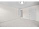 Bright bedroom with plush carpet, recessed lighting, and doors leading to additional rooms at 4120 Cordova Ln, Cumming, GA 30028