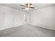 Bright bedroom with plush carpet, recessed lighting, and doors leading to additional rooms at 4120 Cordova Ln, Cumming, GA 30028