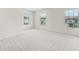 Spacious bedroom featuring neutral carpet and three windows providing lots of natural light at 4120 Cordova Ln, Cumming, GA 30028