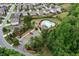 Aerial view showcasing the community pool, playground, and surrounding lush landscaping at 4120 Cordova Ln, Cumming, GA 30028