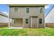 Rear exterior featuring siding and backyard at 4120 Cordova Ln, Cumming, GA 30028
