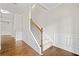 Bright foyer with wood flooring, decorative wainscoting, staircase, and plenty of natural light at 4120 Cordova Ln, Cumming, GA 30028