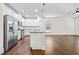 Modern kitchen with stainless steel appliances, white cabinets, granite countertops, and an island at 4120 Cordova Ln, Cumming, GA 30028