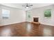 The living room features a cozy fireplace, natural light, and hardwood floors at 4120 Cordova Ln, Cumming, GA 30028