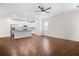 Open concept living room with kitchen with island bar with stainless appliances at 4120 Cordova Ln, Cumming, GA 30028