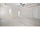 Spacious bedroom with tray ceiling, ceiling fan, and carpeted floors at 4120 Cordova Ln, Cumming, GA 30028