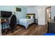 Comfortable bedroom with modern desk, chair, wooden floors and neutral color scheme at 5830 Sterling Ct, Cumming, GA 30040