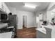 Bright kitchen with stainless steel appliances and modern cabinetry at 5830 Sterling Ct, Cumming, GA 30040