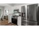 Updated kitchen with stainless steel appliances and adjacent dining area at 5830 Sterling Ct, Cumming, GA 30040