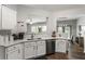 Open kitchen with stainless steel appliances and plenty of counter space at 5830 Sterling Ct, Cumming, GA 30040