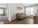 Relaxing living room with wood floors, natural light, and comfortable seating at 5830 Sterling Ct, Cumming, GA 30040