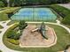 Aerial view of playground and tennis courts with lush landscaping at 5830 Sterling Ct, Cumming, GA 30040
