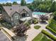 Community pool area with a large pool and patio with lounge chairs at 5830 Sterling Ct, Cumming, GA 30040