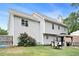 Grey sided house with a backyard with a table set, bush and a gazebo with lush green grass at 10 Callaway Ct, Hiram, GA 30141
