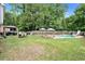Expansive backyard featuring a pool, patio with gazebo, and ample green space at 10 Callaway Ct, Hiram, GA 30141