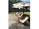 Well appointed backyard pool area with lounge seating and shade umbrellas at 10 Callaway Ct, Hiram, GA 30141