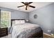 Comfortable bedroom with a ceiling fan, and natural light from the window at 10 Callaway Ct, Hiram, GA 30141