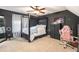 Bedroom with a four-poster bed, dark walls and modern furniture at 10 Callaway Ct, Hiram, GA 30141