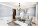 Light-filled dining room with a glass table, modern chairs, and stylish decor at 10 Callaway Ct, Hiram, GA 30141