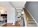 Foyer featuring hardwood floors, staircase, decorative columns and neutral color palette at 10 Callaway Ct, Hiram, GA 30141