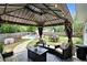Cozy outdoor gazebo with comfortable seating, perfect for entertaining near the pool at 10 Callaway Ct, Hiram, GA 30141