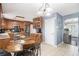 Eat-in kitchen featuring stainless steel appliances, wooden cabinets, light countertops, and a center wooden table at 10 Callaway Ct, Hiram, GA 30141