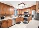 Bright kitchen featuring stainless steel appliances, light countertops, wooden cabinets and tile flooring at 10 Callaway Ct, Hiram, GA 30141
