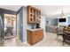 Well-lit kitchen with wood cabinets, tile floors, view to living room, and modern appliances at 10 Callaway Ct, Hiram, GA 30141