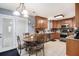 Kitchen featuring wood cabinets, stainless steel appliances, tiled flooring and a breakfast table at 10 Callaway Ct, Hiram, GA 30141