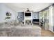 Cozy living room with a fireplace, plush sofa, and ample natural light at 10 Callaway Ct, Hiram, GA 30141