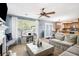 Open-concept living area with a fireplace, backyard view, and seamless flow to the kitchen at 10 Callaway Ct, Hiram, GA 30141