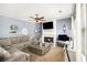 Comfortable living room with a fireplace, ceiling fan, and neutral color palette at 10 Callaway Ct, Hiram, GA 30141
