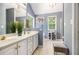 Beautiful main bathroom featuring double vanity, soaking tub, and large window at 10 Callaway Ct, Hiram, GA 30141