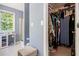 Main bathroom includes shower, storage cabinet and view into the walk-in closet at 10 Callaway Ct, Hiram, GA 30141