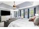 Bright primary bedroom with tray ceilings, natural light, and a sitting area at 10 Callaway Ct, Hiram, GA 30141