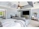 Spacious primary bedroom featuring a sitting area, tray ceilings, and lots of natural light at 10 Callaway Ct, Hiram, GA 30141