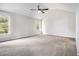 Large bedroom features vaulted ceilings, neutral carpet, and dual windows at 1024 Odelle Cir, Mcdonough, GA 30253