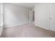 Spacious bedroom featuring neutral colored carpet, and an open entry at 1024 Odelle Cir, Mcdonough, GA 30253